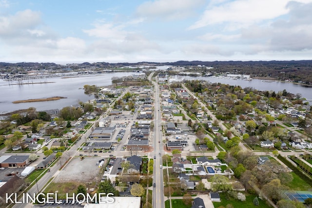 223 E Savidge St, Spring Lake, MI 49456 - aerial overview of property's location with a nearby body of water and nearby suburban area