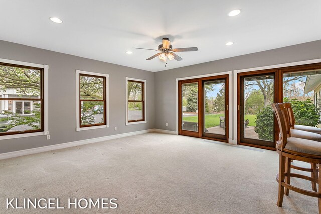223 E Savidge St, Spring Lake, MI 49456 - spare room with baseboards, recessed lighting, light colored carpet, and plenty of natural light