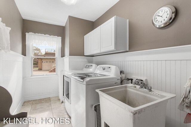 223 E Savidge St, Spring Lake, MI 49456 - laundry room featuring wainscoting, cabinet space, and separate washer and dryer