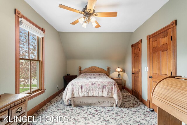 223 E Savidge St, Spring Lake, MI 49456 - bedroom with multiple windows, lofted ceiling, baseboards, carpet flooring, and a ceiling fan