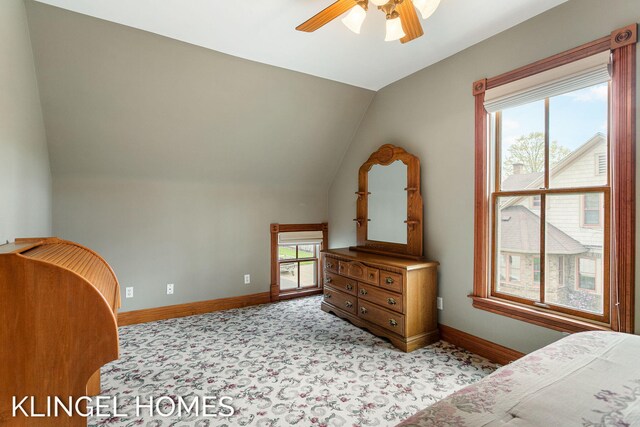 223 E Savidge St, Spring Lake, MI 49456 - bedroom with vaulted ceiling, baseboards, a ceiling fan, and light colored carpet