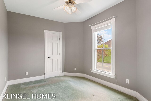 223 E Savidge St, Spring Lake, MI 49456 - carpeted spare room featuring a ceiling fan and baseboards