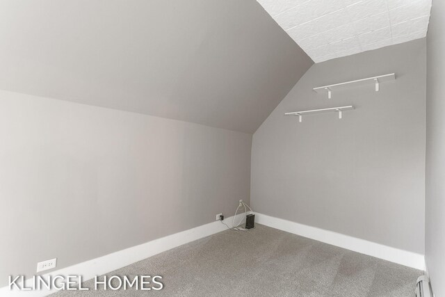 223 E Savidge St, Spring Lake, MI 49456 - laundry area featuring carpet floors, baseboard heating, and baseboards