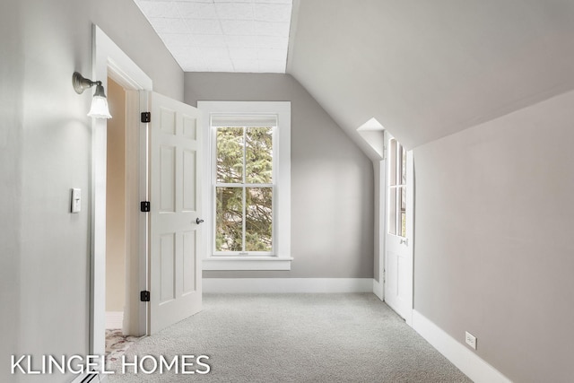 223 E Savidge St, Spring Lake, MI 49456 - bonus room featuring carpet, baseboards, and vaulted ceiling