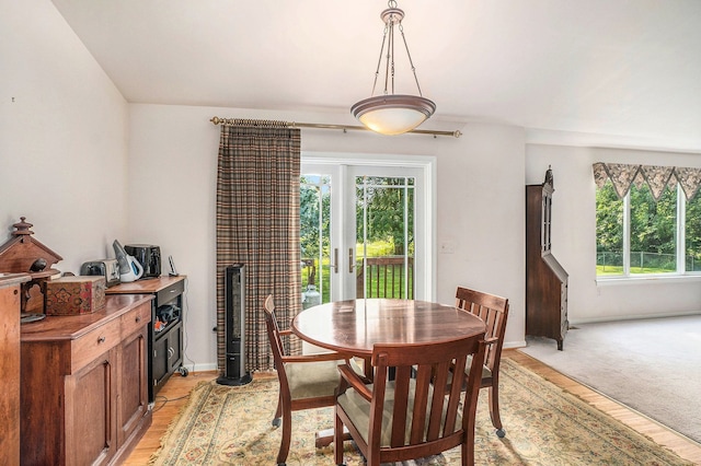 dining space with plenty of natural light and baseboards