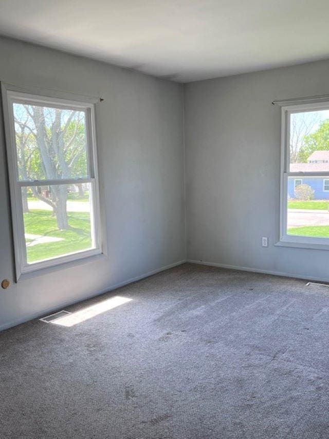9455 N Parkwood Dr, Davison, MI 48423 - spare room featuring carpet floors and baseboards