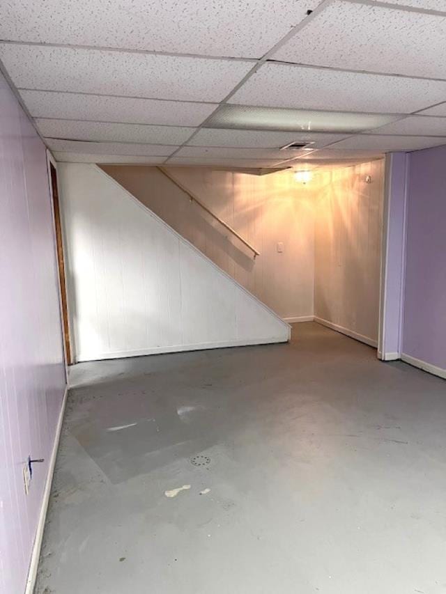 9455 N Parkwood Dr, Davison, MI 48423 - finished basement with baseboards, a paneled ceiling, and wooden walls