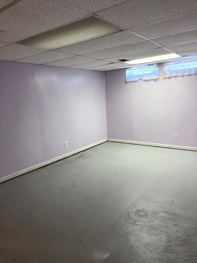 9455 N Parkwood Dr, Davison, MI 48423 - below grade area featuring baseboards and a drop ceiling