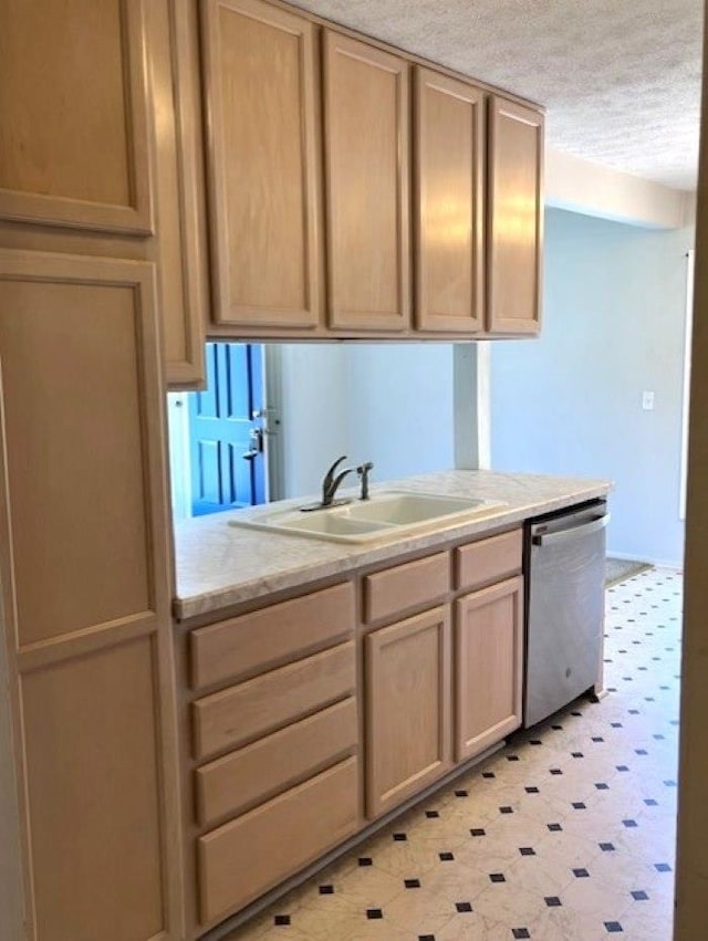9455 N Parkwood Dr, Davison, MI 48423 - kitchen with dishwasher, light floors, a sink, a textured ceiling, and light brown cabinets