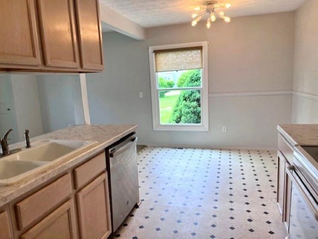 9455 N Parkwood Dr, Davison, MI 48423 - kitchen featuring stainless steel dishwasher, a sink, a chandelier, light floors, and light countertops