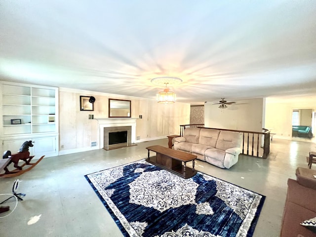 103 Lukesport Dr, Quincy, MI 49082 - living area with finished concrete floors, baseboards, and a fireplace