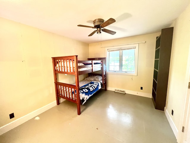 103 Lukesport Dr, Quincy, MI 49082 - bedroom with concrete floors, baseboards, and a ceiling fan
