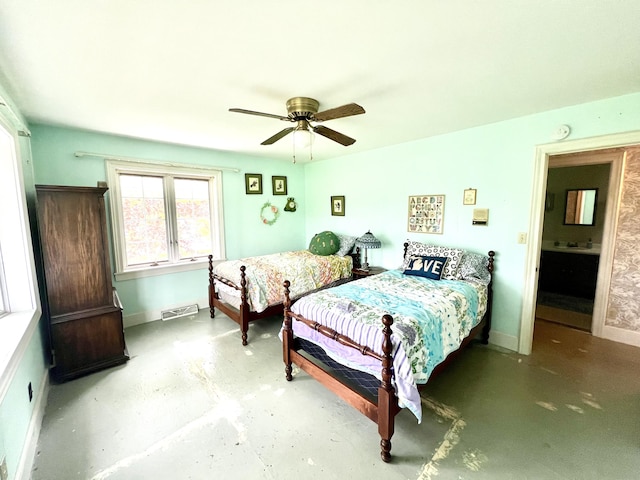 103 Lukesport Dr, Quincy, MI 49082 - bedroom featuring concrete flooring, a ceiling fan, and baseboards