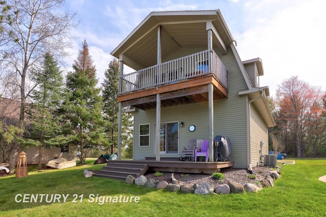 730 S Point Rd, Gladwin, MI 48624 - rear view of house with a balcony, a yard, a wooden deck, and central AC