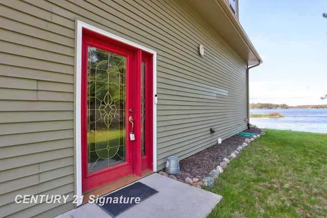 730 S Point Rd, Gladwin, MI 48624 - entrance to property with a water view and a lawn