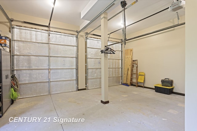 730 S Point Rd, Gladwin, MI 48624 - garage featuring baseboards