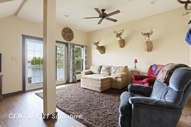 730 S Point Rd, Gladwin, MI 48624 - living room featuring wood finished floors, a ceiling fan, lofted ceiling, and baseboards