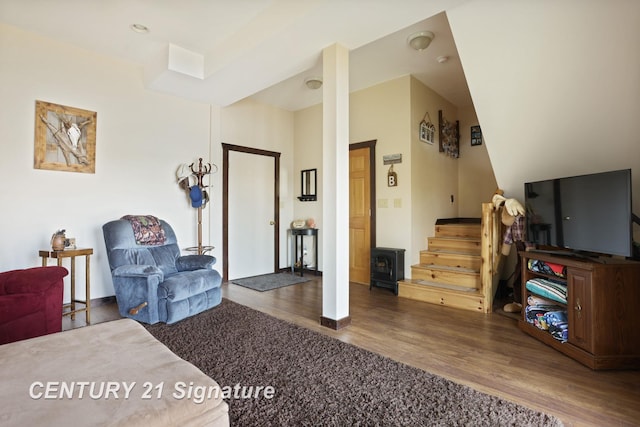 730 S Point Rd, Gladwin, MI 48624 - living room with wood finished floors, stairway, and baseboards