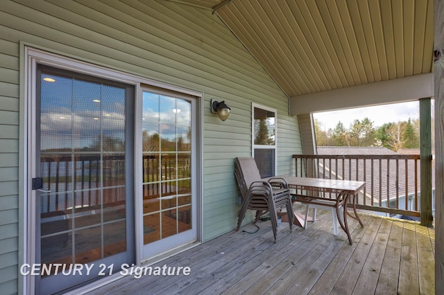 730 S Point Rd, Gladwin, MI 48624 - wooden deck with outdoor dining area