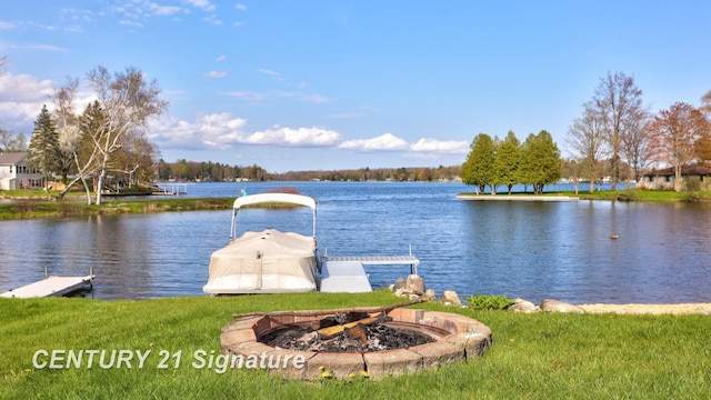 730 S Point Rd, Gladwin, MI 48624 - dock with an outdoor fire pit and a water view