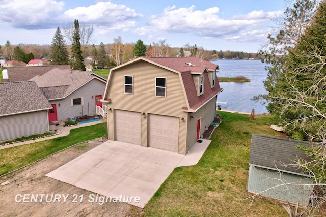730 S Point Rd, Gladwin, MI 48624 - view of front of property featuring a gambrel roof, an attached garage, a water view, and a front lawn