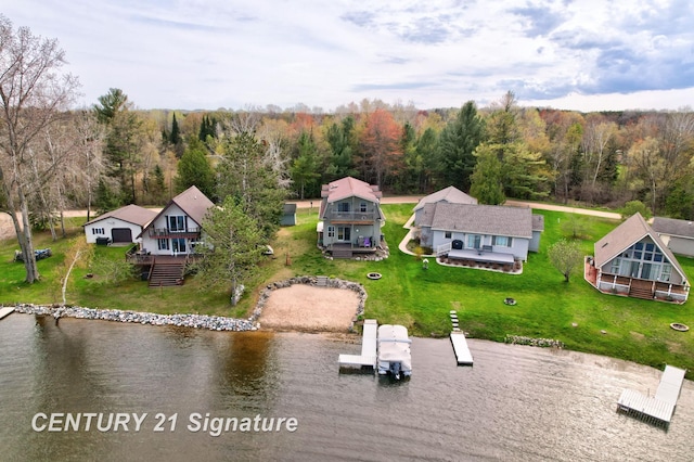 730 S Point Rd, Gladwin, MI 48624 - view from above of property featuring a nearby body of water and a heavily wooded area