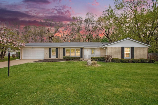 1507 Pinehurst Ln, Niles, MI 49120 - single story home featuring an attached garage, concrete driveway, brick siding, and a lawn