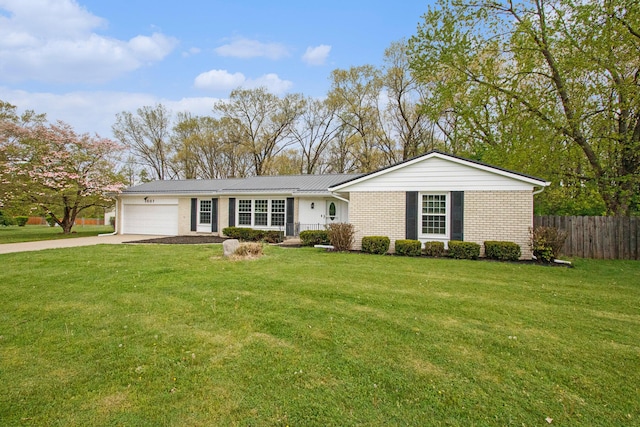 1507 Pinehurst Ln, Niles, MI 49120 - ranch-style house with a garage, concrete driveway, and brick siding