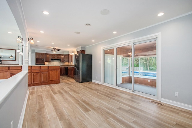 1507 Pinehurst Ln, Niles, MI 49120 - kitchen with freestanding refrigerator, ceiling fan, tasteful backsplash, baseboards, and light wood-style floors