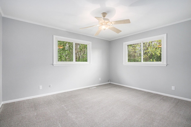 1507 Pinehurst Ln, Niles, MI 49120 - empty room featuring healthy amount of natural light, crown molding, carpet floors, baseboards, and ceiling fan