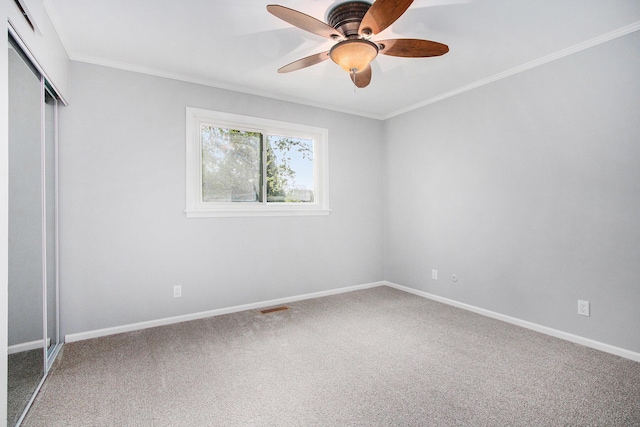 1507 Pinehurst Ln, Niles, MI 49120 - unfurnished bedroom with carpet floors, a closet, ornamental molding, baseboards, and ceiling fan