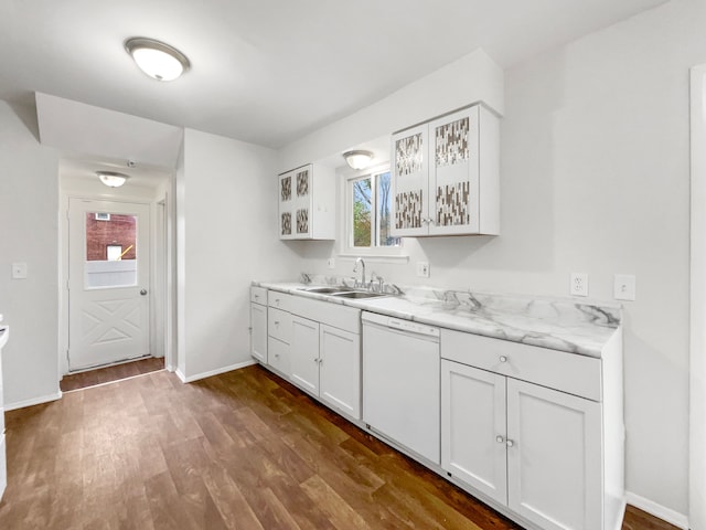 kitchen with dishwasher, a sink, dark wood finished floors, baseboards, and white cabinets