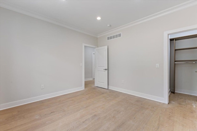 3408 Eastern Ave, Rochester Hills, MI 48307 - unfurnished bedroom featuring crown molding, light wood finished floors, baseboards, a walk in closet, and recessed lighting