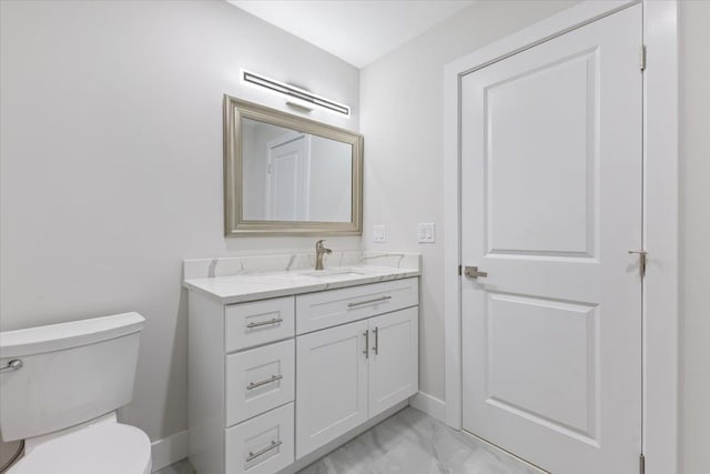3408 Eastern Ave, Rochester Hills, MI 48307 - bathroom featuring toilet, baseboards, vanity, and marble finish flooring
