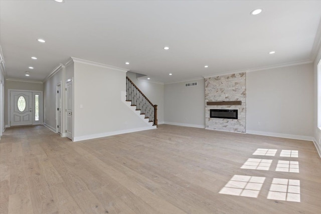 3408 Eastern Ave, Rochester Hills, MI 48307 - unfurnished living room featuring ornamental molding, stairs, light wood-type flooring, baseboards, and recessed lighting
