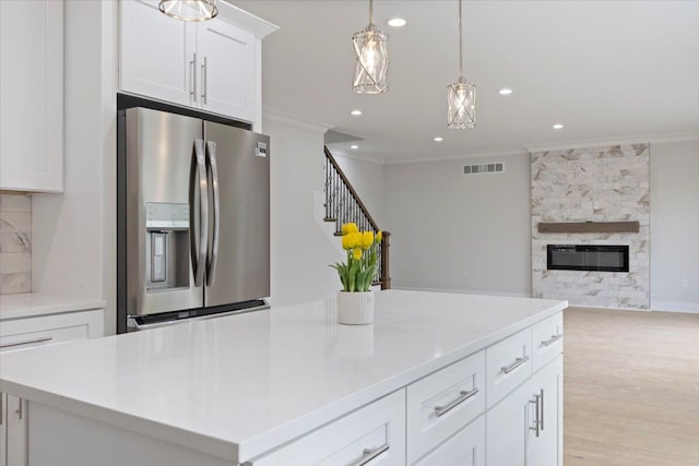 3408 Eastern Ave, Rochester Hills, MI 48307 - kitchen with stainless steel refrigerator with ice dispenser, ornamental molding, open floor plan, white cabinetry, and recessed lighting