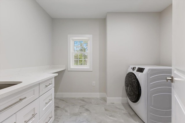 3408 Eastern Ave, Rochester Hills, MI 48307 - washroom featuring washer / dryer, light marble finish flooring, cabinet space, and baseboards