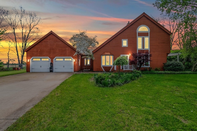 rustic home with concrete driveway, a front yard, and a garage