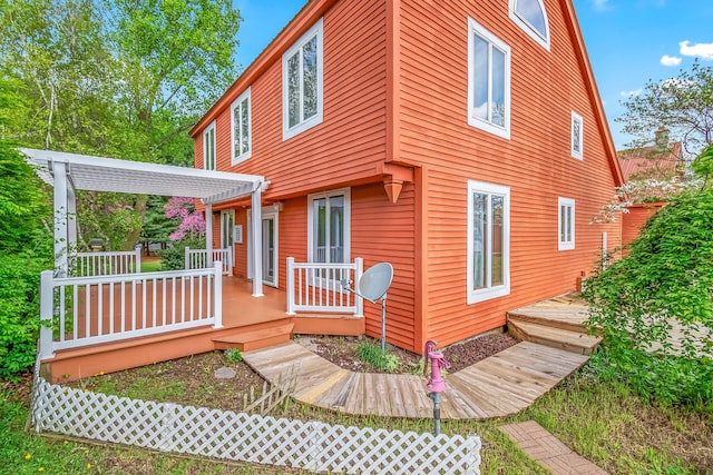 rear view of property with a deck