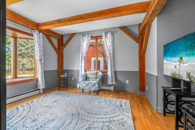sitting room featuring a wainscoted wall, a baseboard radiator, beam ceiling, and wood finished floors