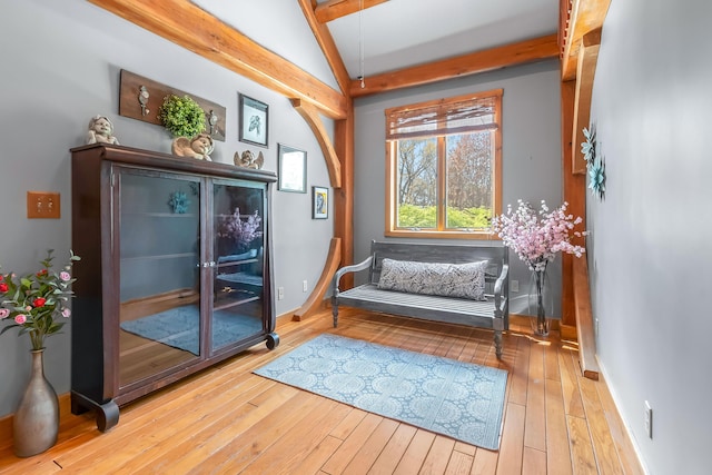 living area with hardwood / wood-style floors and baseboards