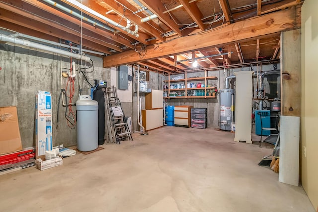 unfinished below grade area featuring a water softener system, water heater, electric panel, and a heating unit