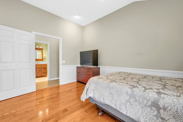 4953 Clintonville Rd, Clarkston, MI 48346 - bedroom with wainscoting and light wood-style flooring