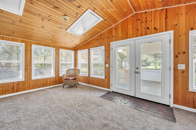 4953 Clintonville Rd, Clarkston, MI 48346 - unfurnished sunroom featuring a skylight, french doors, vaulted ceiling, wooden walls, and plenty of natural light