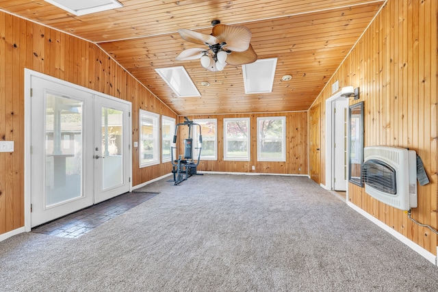 4953 Clintonville Rd, Clarkston, MI 48346 - unfurnished sunroom featuring a skylight, heating unit, wood walls, lofted ceiling, and carpet flooring