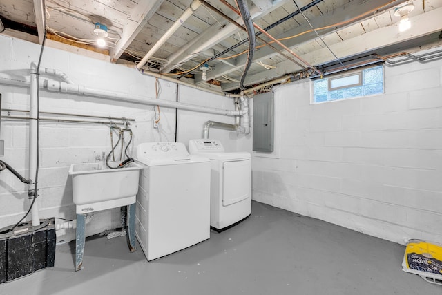 4953 Clintonville Rd, Clarkston, MI 48346 - clothes washing area with electric panel and washing machine and dryer