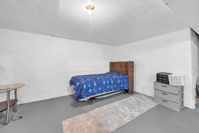 4953 Clintonville Rd, Clarkston, MI 48346 - bedroom featuring finished concrete flooring and concrete block wall