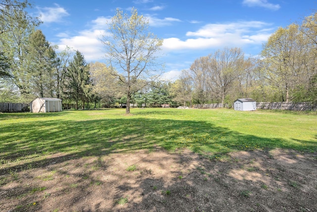 4953 Clintonville Rd, Clarkston, MI 48346 - view of yard with a storage unit and an outbuilding