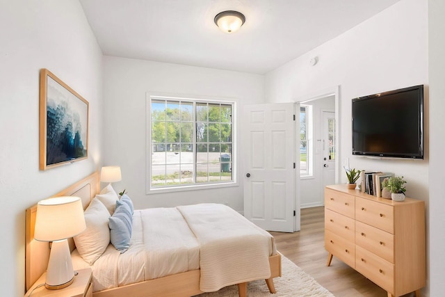 bedroom with light wood finished floors