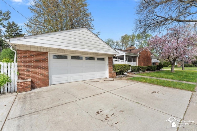view of front of home featuring brick siding and driveway